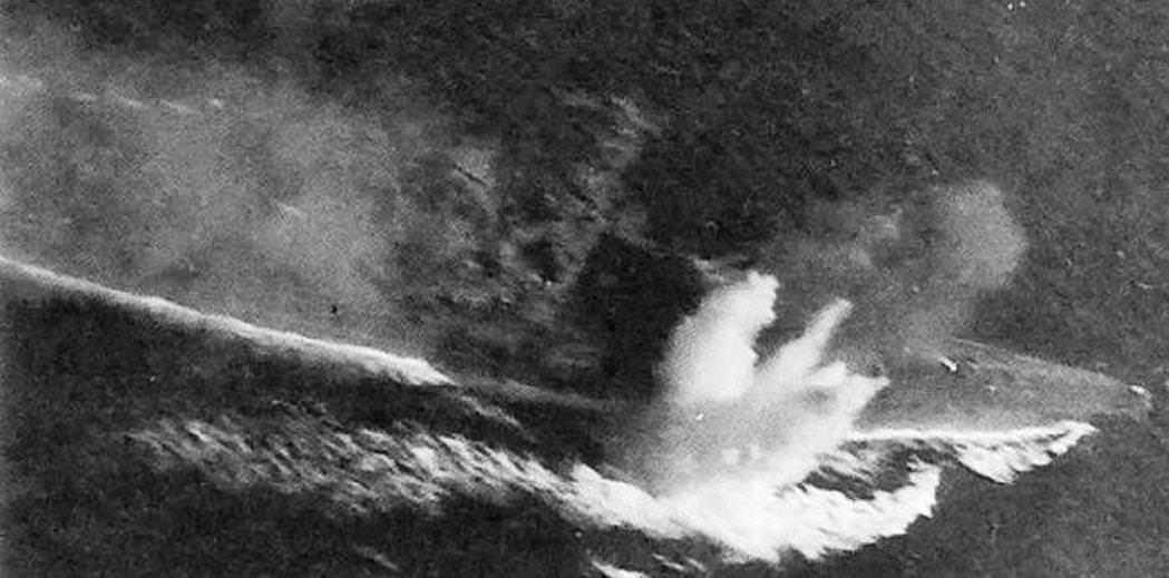 1944 - Bombs Score a Hit and a Near Miss on Musashi, October 1944.JPG
